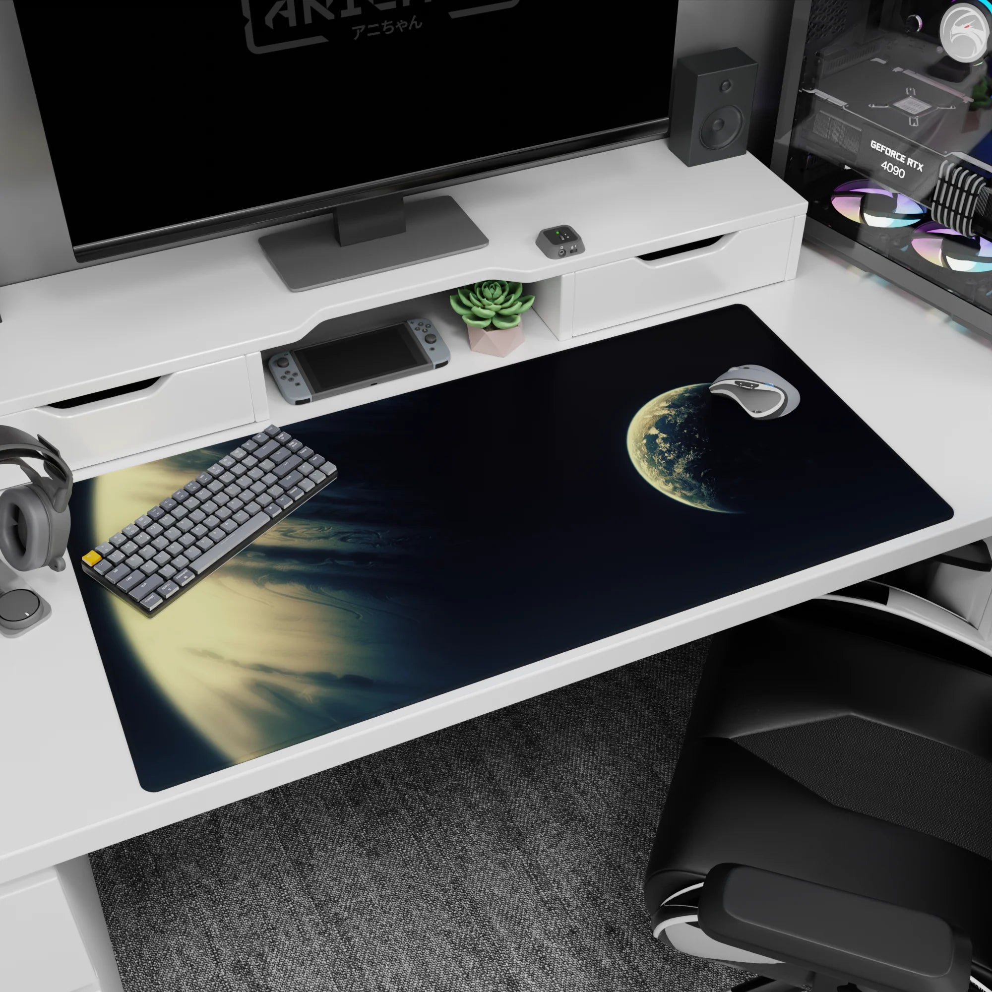 Giant cream-and-gold planet rim desk pad 40x20 inches with a smaller glowing planet on the right.