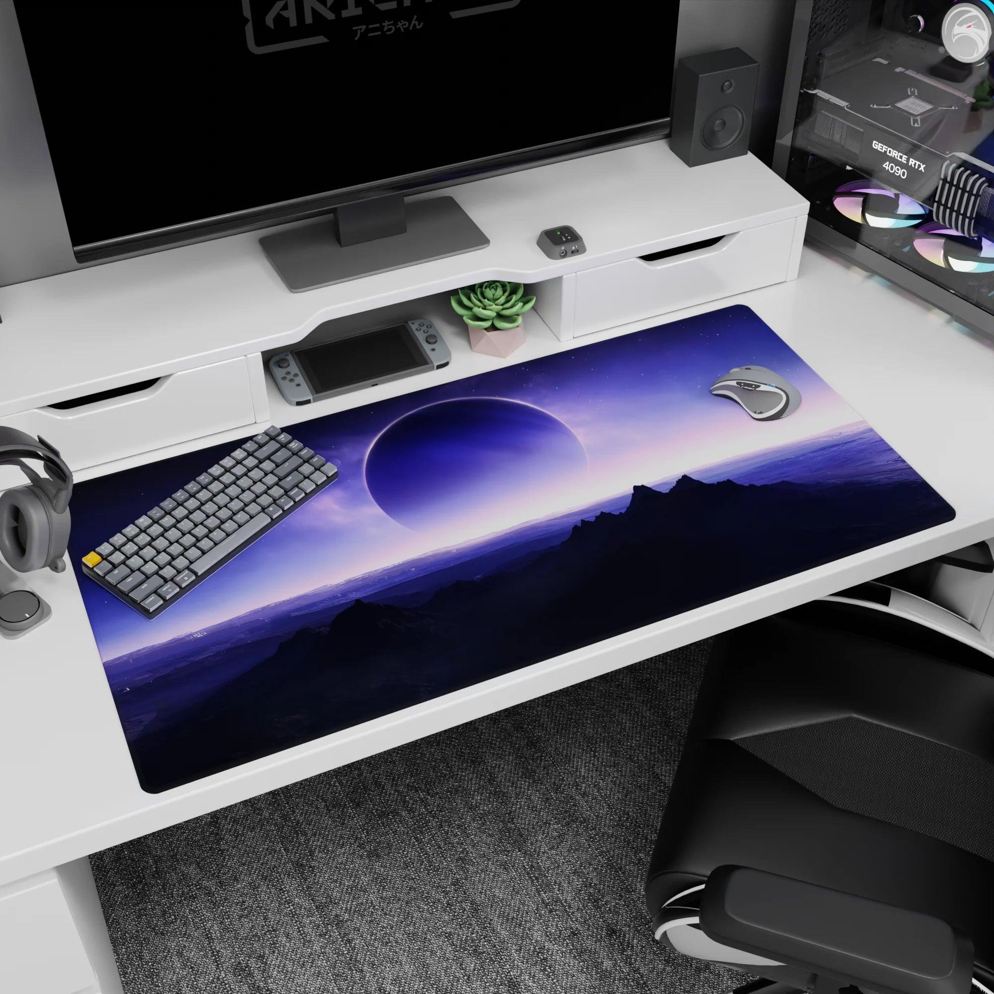 Giant moon over dark mountain silhouettes desk pad 40x20 inches under a violet alien sky.