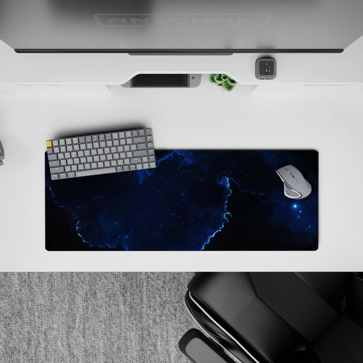 Moody cosmic mouse pad 32x12 inches in deep ocean blues and black with electric blue cloud-edge glow.
