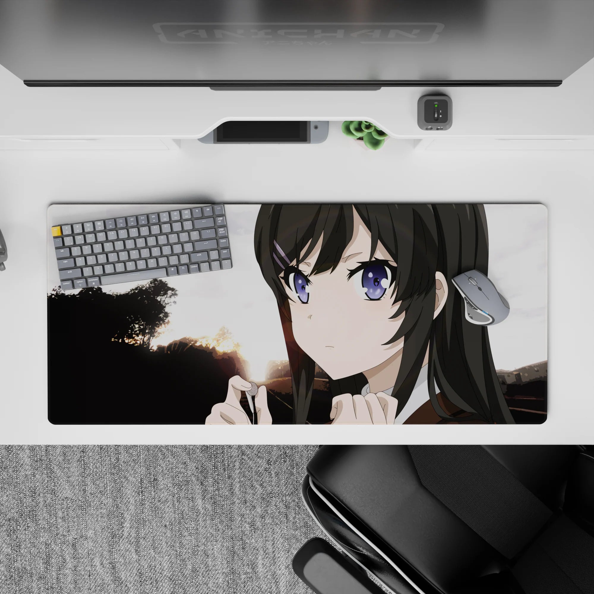 Cozy dusk gradient anime desk pad 36x16 inches in warm sunset tones with bold tree silhouettes.