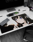 Anime girl with sharp purple eyes at sunset desk pad 40x20 inches, bold tree silhouettes behind her.