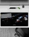 Smoky black cosmic mouse pad 32x16 inches with cool blue glow and crisp orange accents.