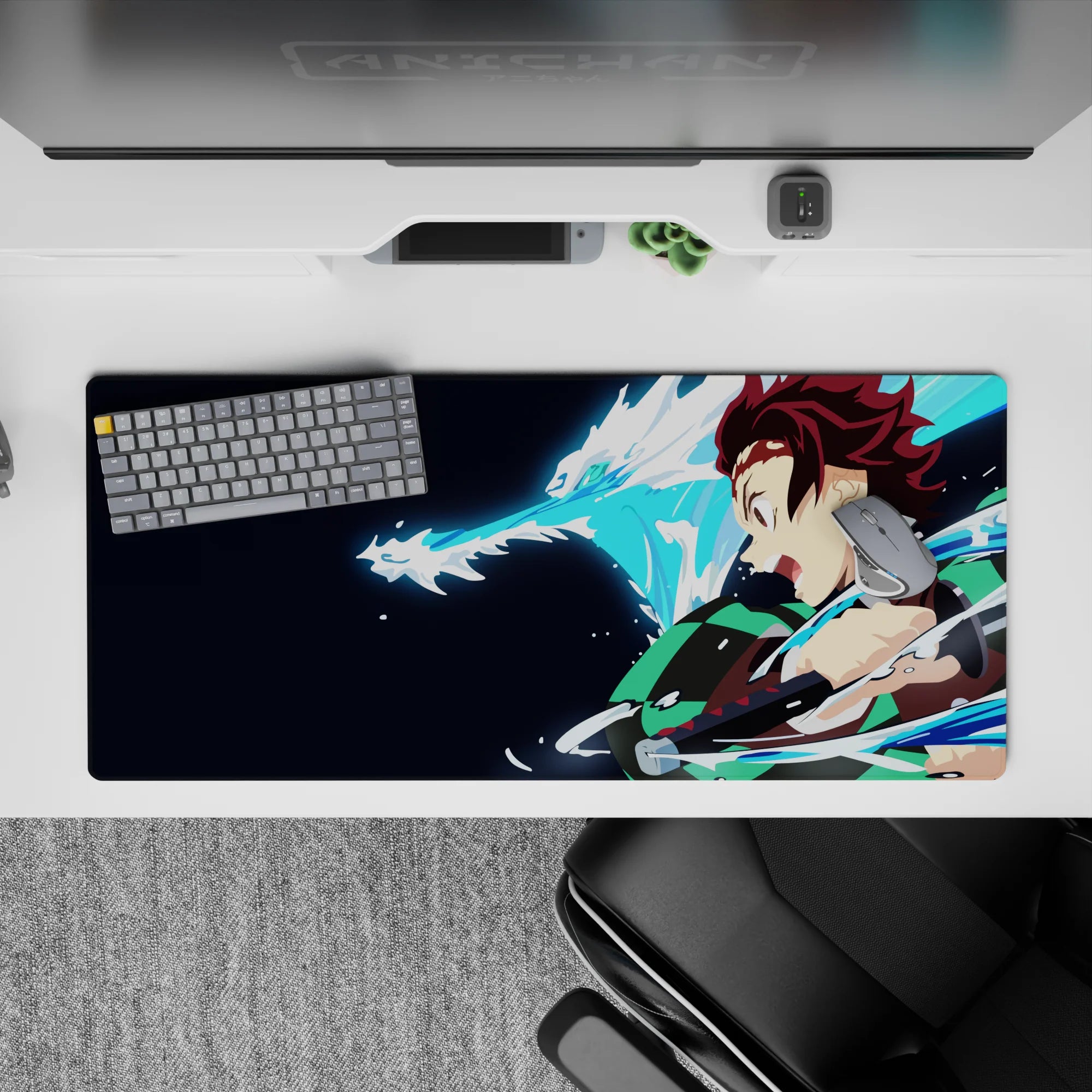 Tanjiro from Demon Slayer on 36x16 inch anime desk pad, showcasing a water dragon attack with vibrant colors and dynamic energy.
