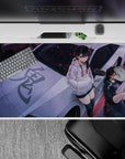 Purple street mood anime desk pad 40x20 inches in black and white hoodies with red spark flecks.