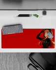 32x12 inches anime girl desk mat in bold crimson and glossy black tones, cool-girl vibe with warm orange hair.