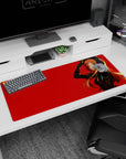 Anime girl in black suit touching her head, big headphones on red backdrop desk pad 36x16 inches.