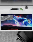 Glowing blue and violet cosmic haze with ember-red sparks desk mouse pad, 32x16 inches.