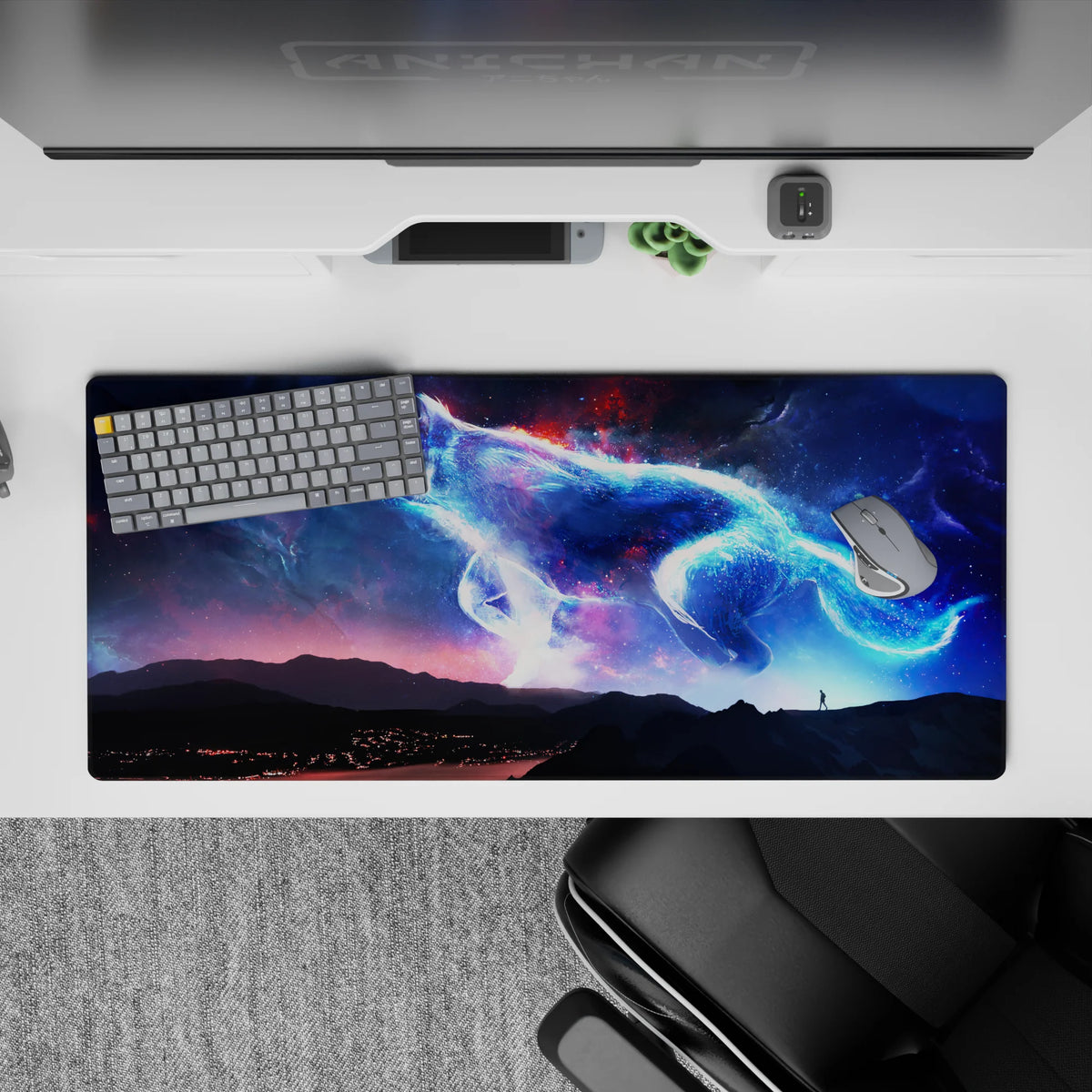 Glowing blues, violet haze, and ember-red sparks on a cosmic desk pad, 36x16 inches.