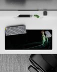 Anime mouse pad 28x12 inches in inky dark tones with green jacket, white top, cool blue-eyed calm mood.