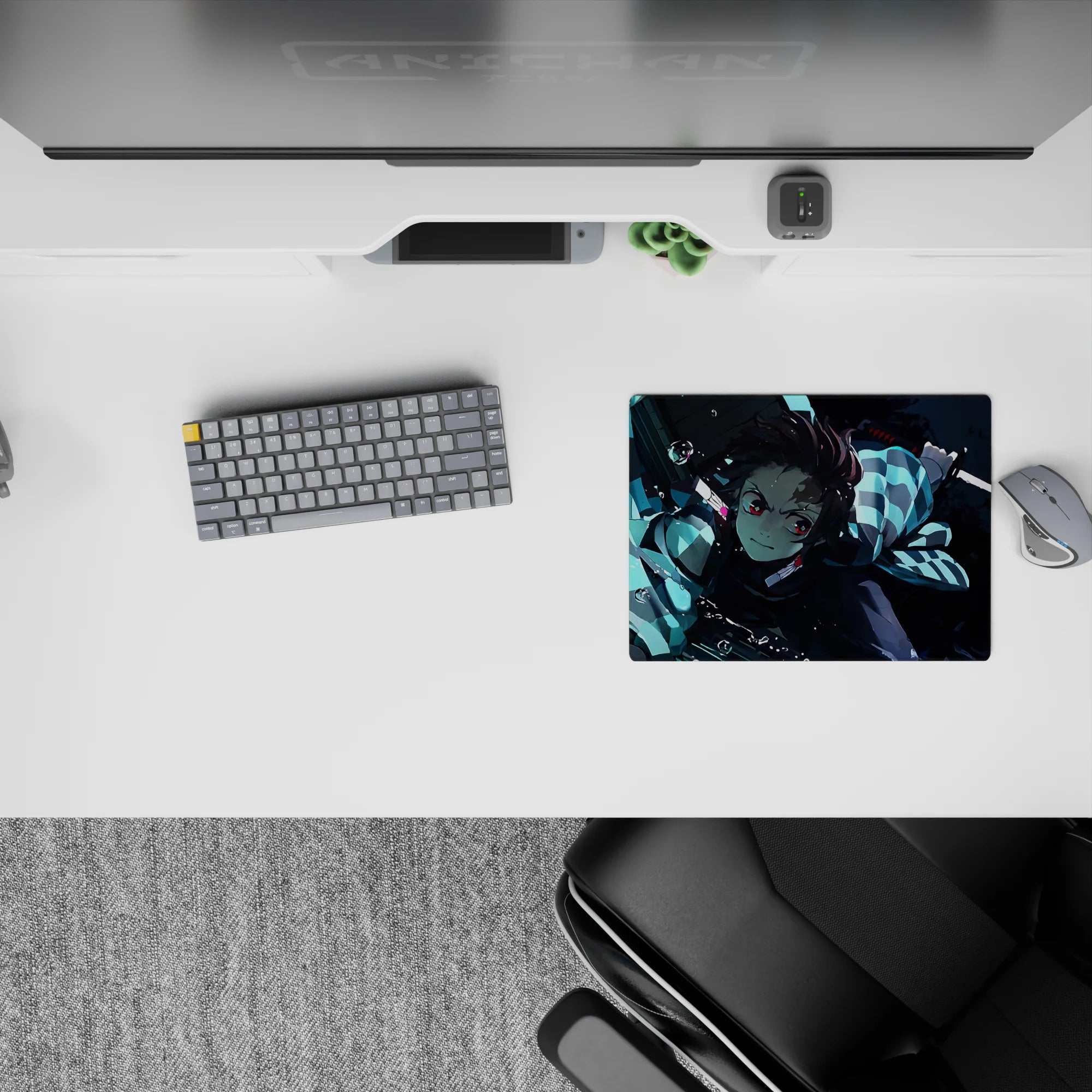 Tanjiro from Demon Slayer mid-strike on 14x10 inch anime mouse pad; water-breathing style with cool blues and light.