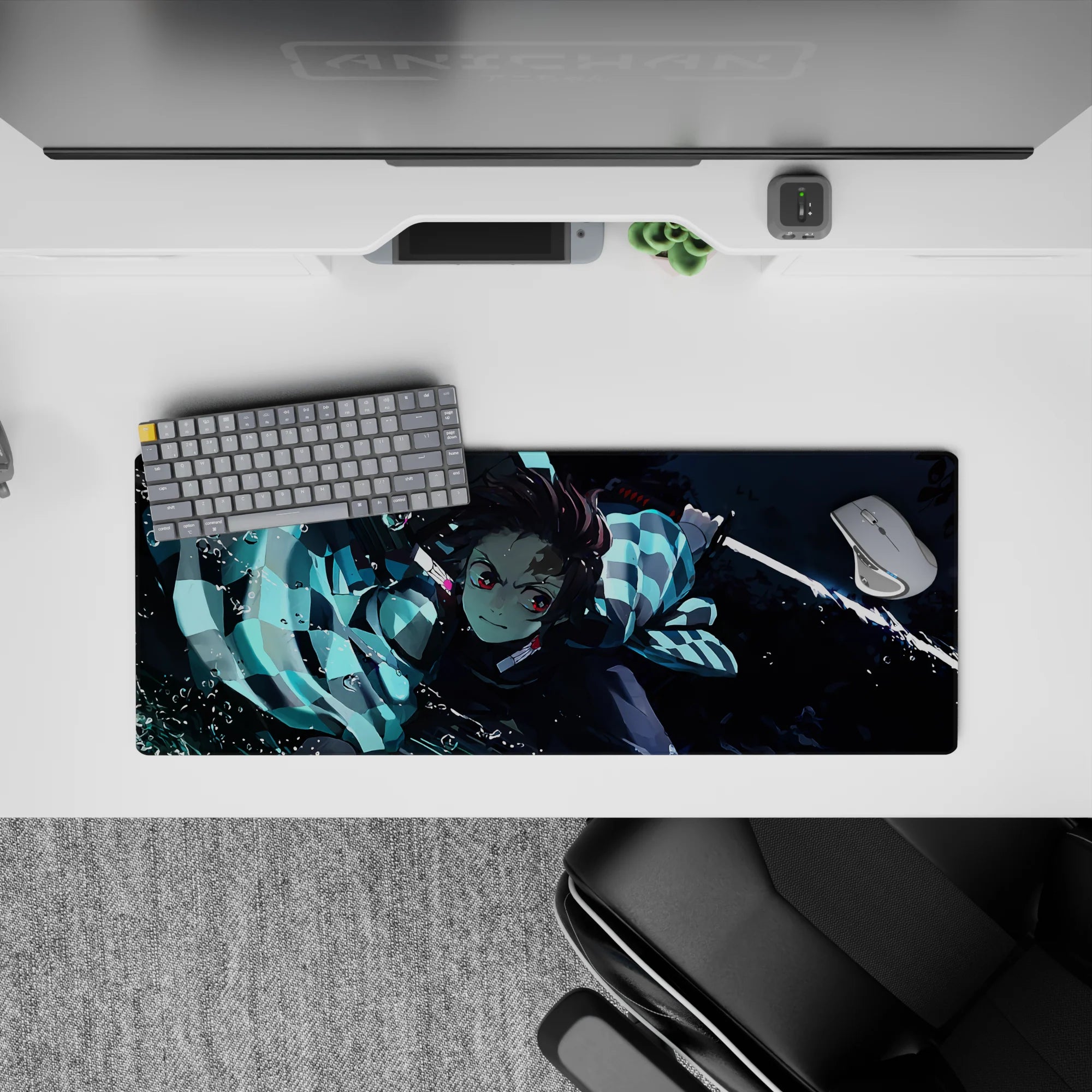 Tanjiro from Demon Slayer in action on a 32x12 inch anime mouse pad, showcasing dynamic water-breathing style artistry.