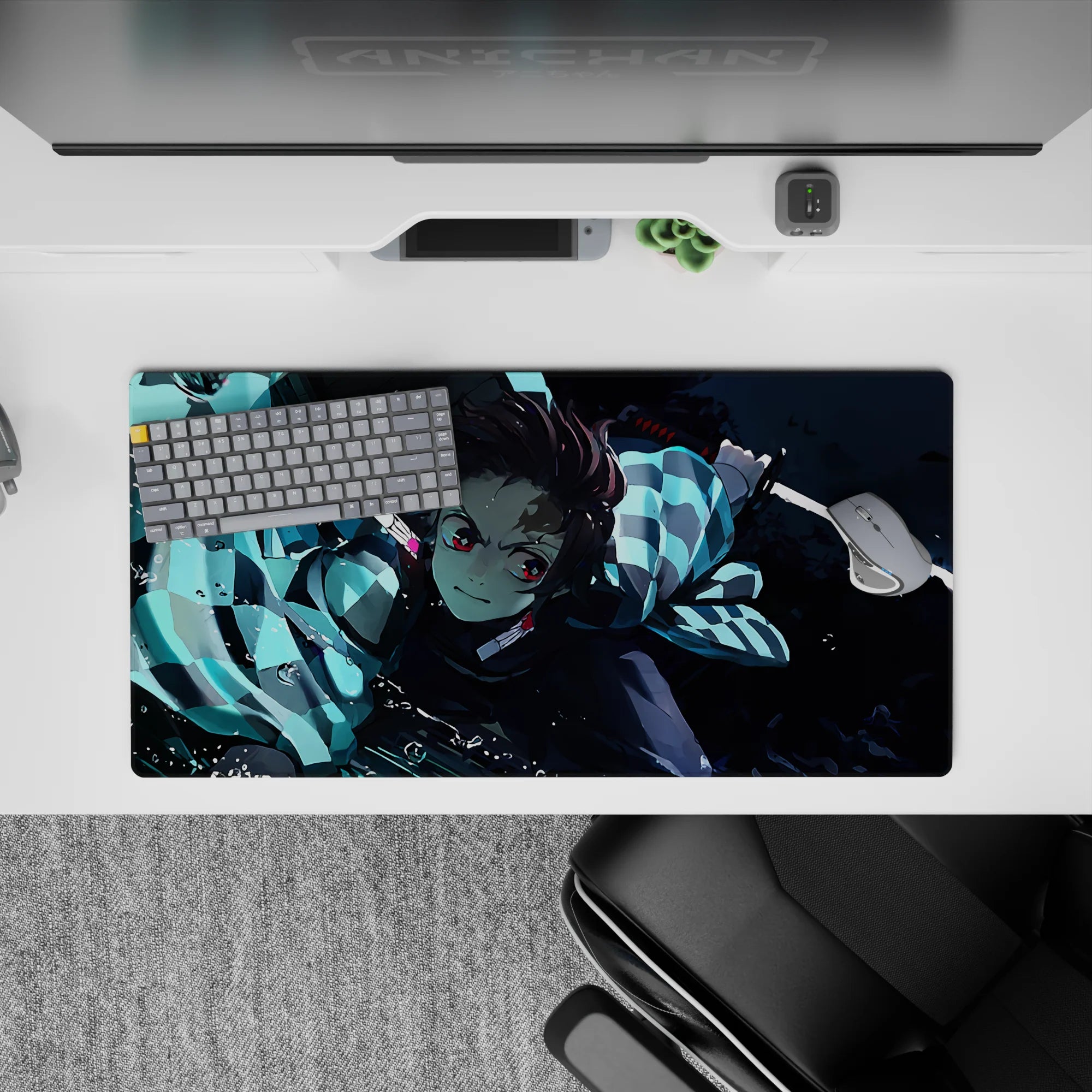 Tanjiro from Demon Slayer in action with water-breathing style on 32x16 inch anime mouse pad, vibrant blues and dynamic art.