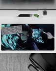 Tanjiro from Demon Slayer in action with water-breathing style on 32x16 inch anime mouse pad, vibrant blues and dynamic art.