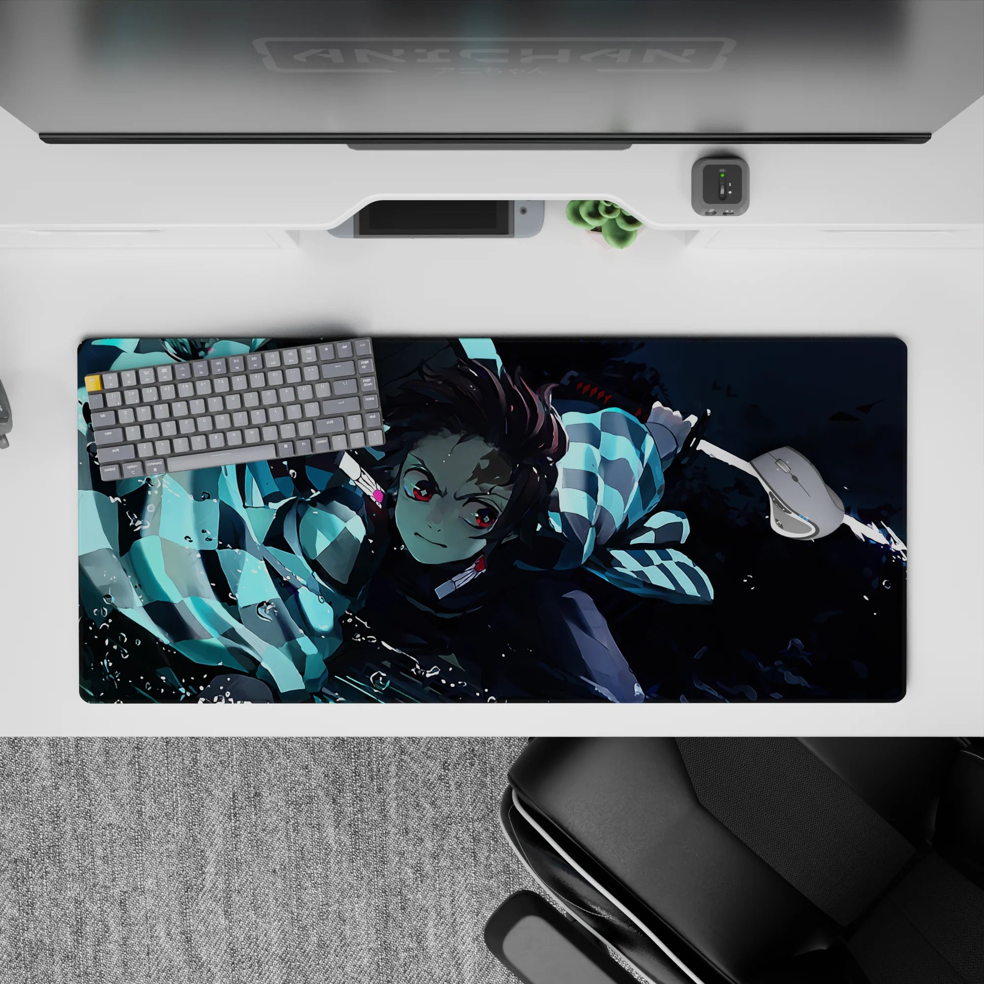 Tanjiro from Demon Slayer in action on a 36x16 inch anime desk pad, featuring dynamic water-breathing style and vivid colors.