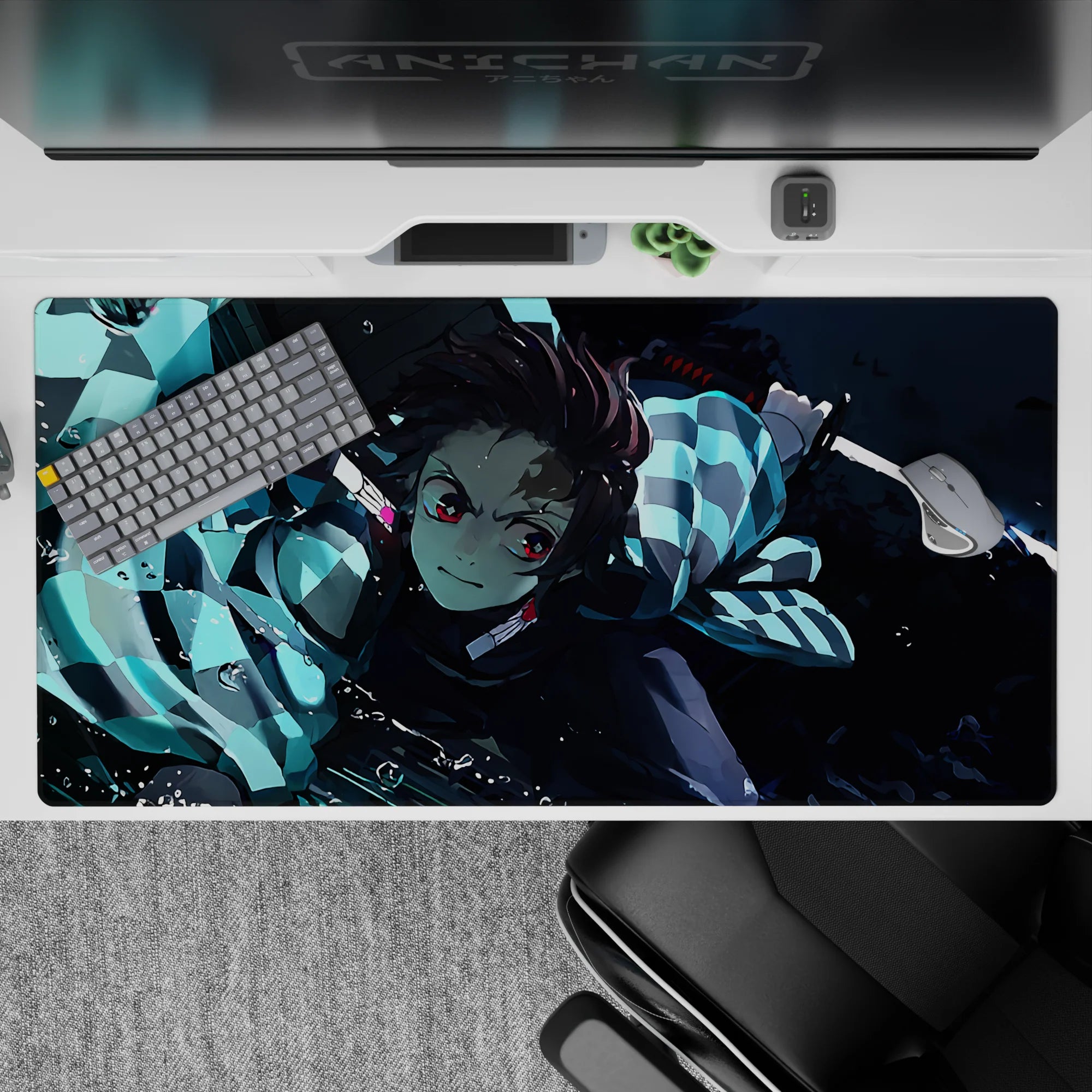 Tanjiro from Demon Slayer in action, water-breathing style on 40x20 inch anime mouse pad, vibrant blues and dynamic design.