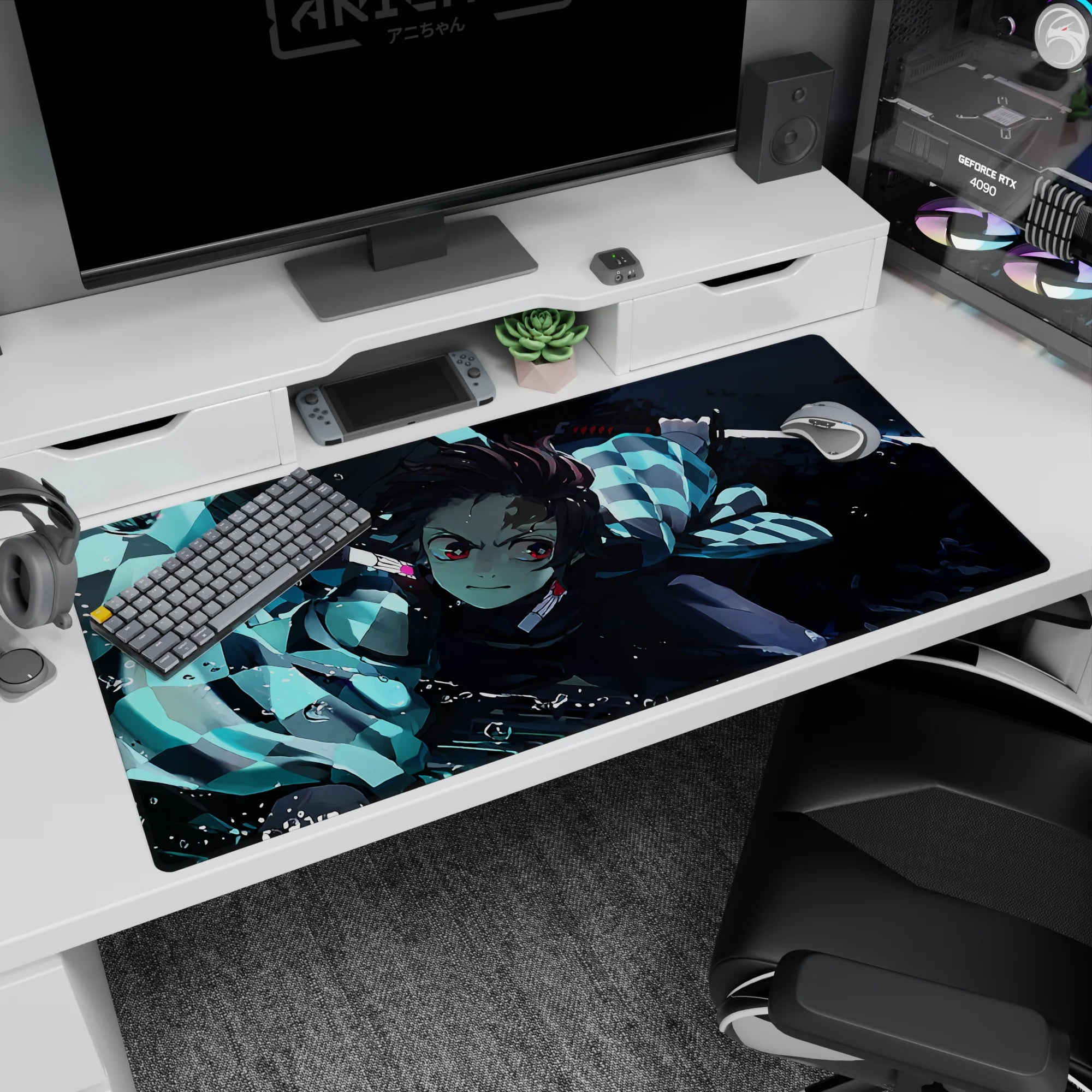 Tanjiro from Demon Slayer in action on a 40x20 inch anime desk pad; vibrant water-breathing style in cool blues.