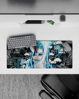28x12 inches anime girl mouse pad in electric cyan and deep black, edgy urban vibe, crisp print.
