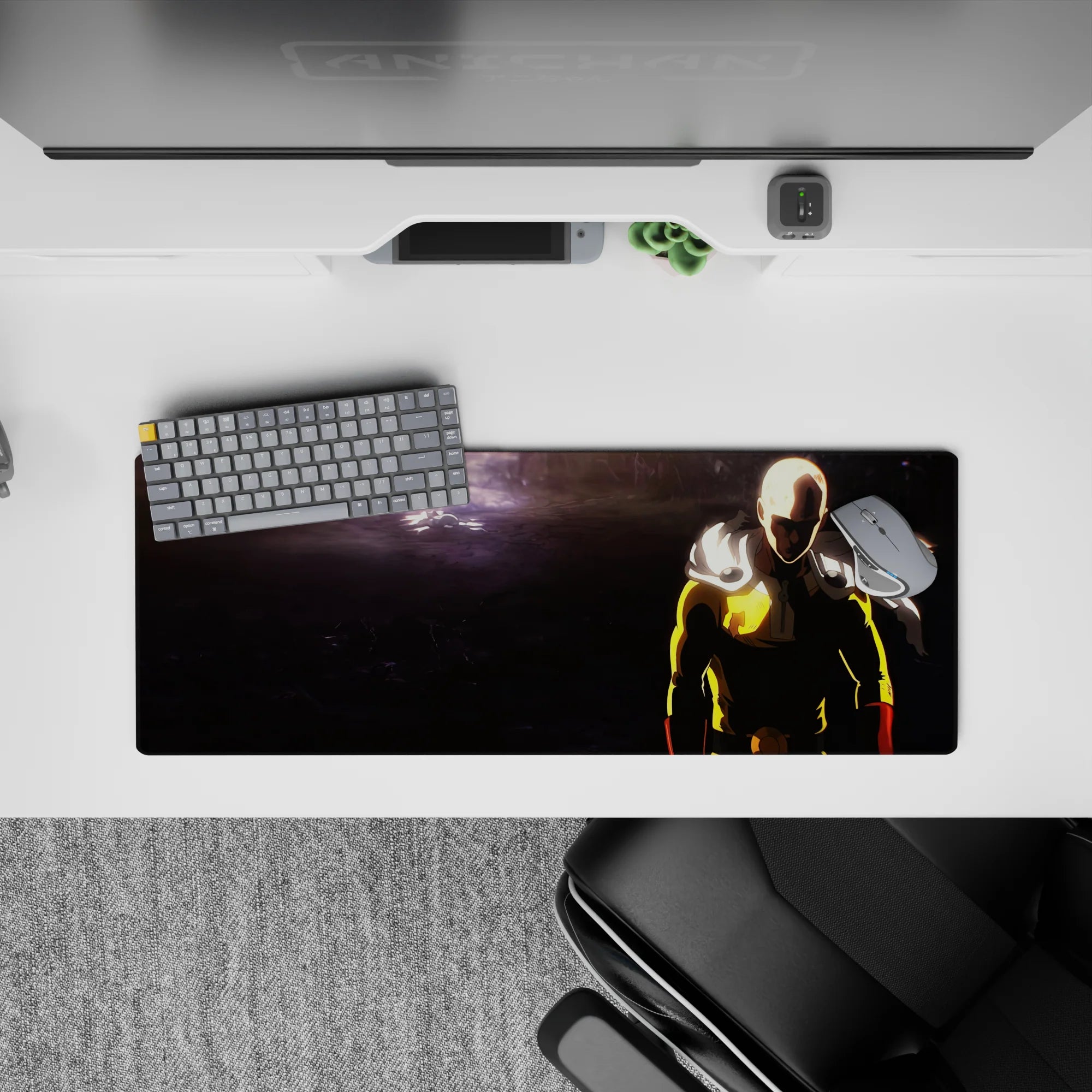 32x12 inches anime mouse pad in bold yellow and red against deep charcoal shadows, intense One Punch Man vibe.