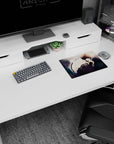 Classic anime mouse pad 14x10 inches showing brooding boy in loose white shirt, knees up, hand near lips.