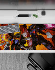 36x16 inches anime desk pad in hot orange-gold blaze, deep blacks, steel greys, neon green eyes.