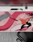 Soft blush pink anime desk pad with playful, mischievous vibe and smooth glide surface, 40x20 inches.
