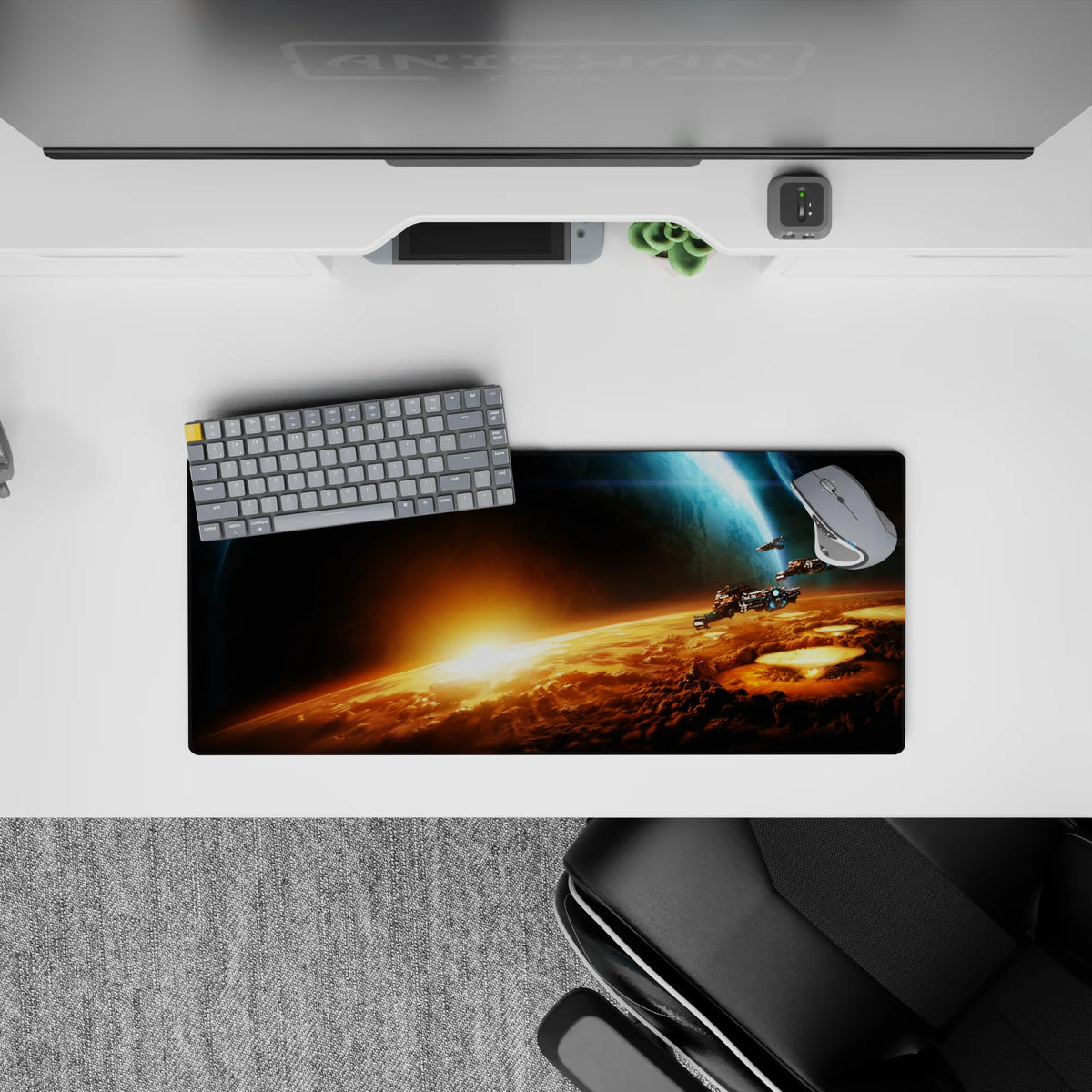 Moody black and deep blue mouse pad, 28x12 inches, with molten orange sunrise glow.