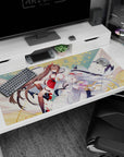 Two anime shrine maidens glide with long ribbons and drifting petals on a 40x20 inches desk pad.