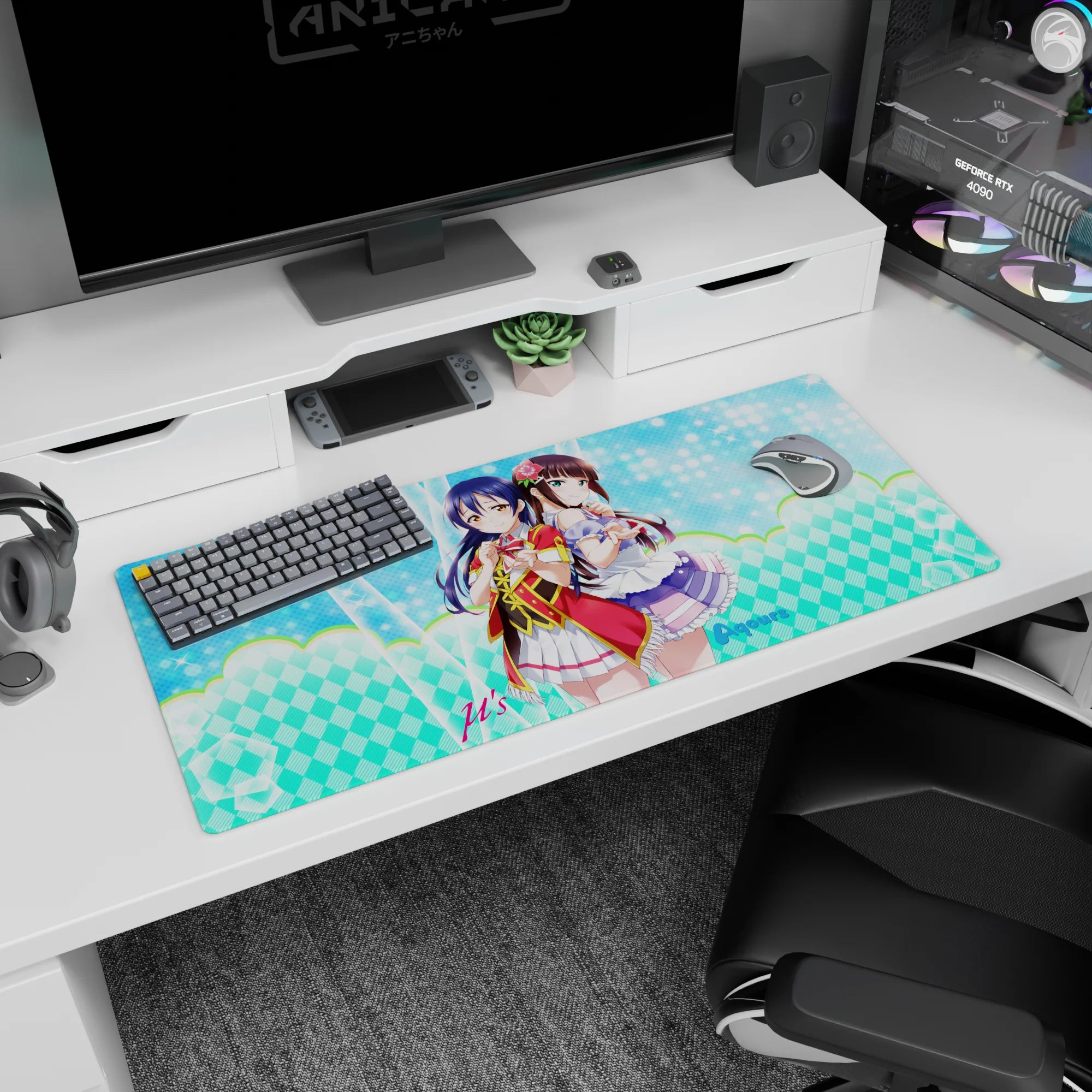 36x16 inches Love Live desk pad featuring Umi Sonoda and Dia Kurosawa in red-trim idol outfits.