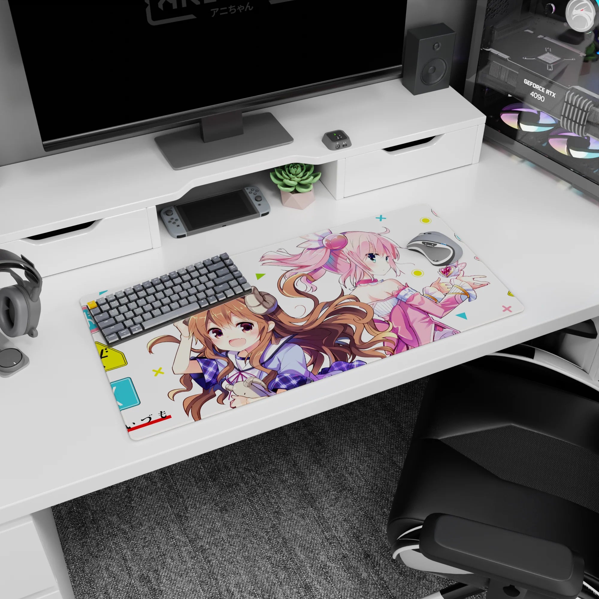 32x16 inches anime mouse pad showing a smiling brown-curled girl with tiny horns and a pink girl in headphones.