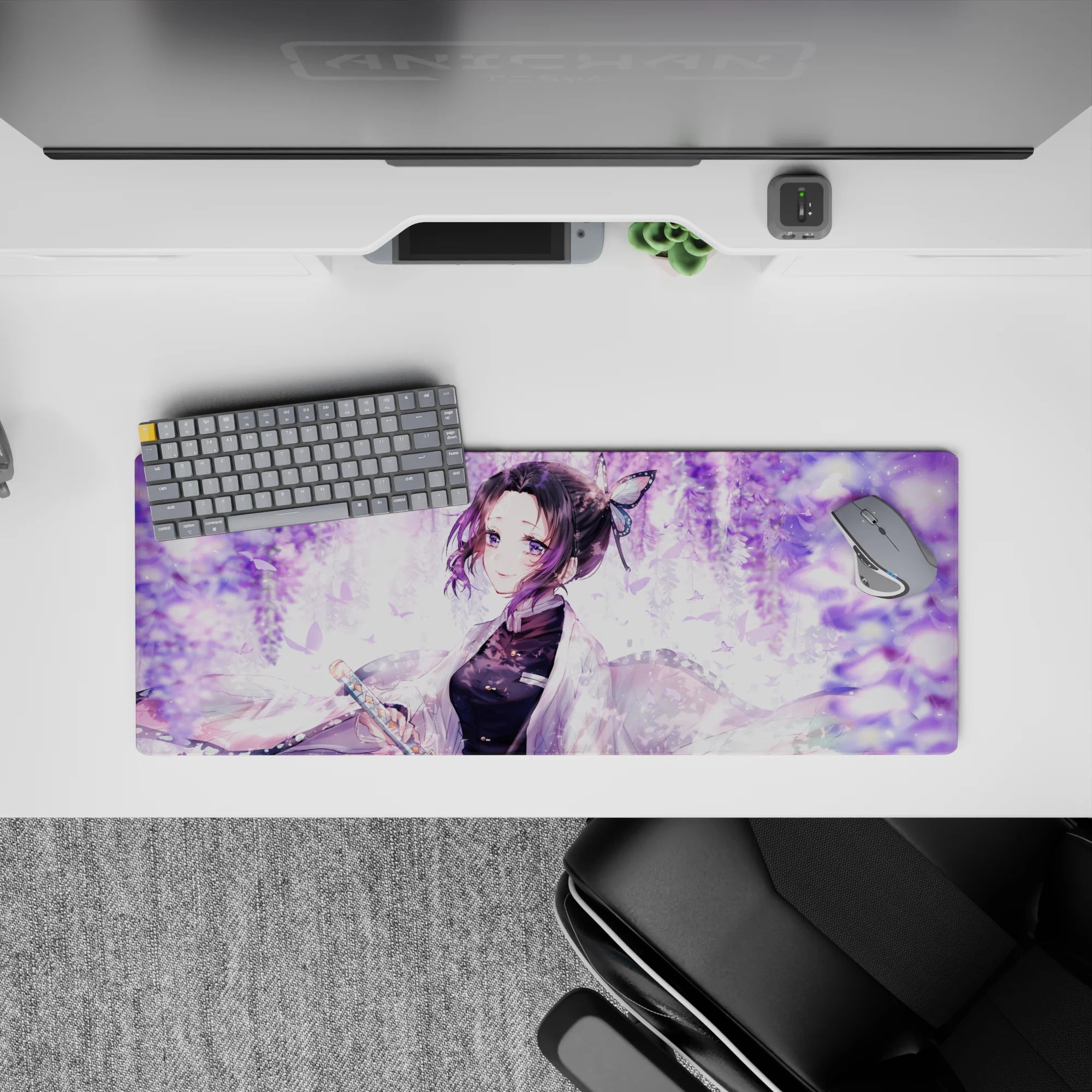 Anime mouse pad 32x12 inches featuring Shinobu from Demon Slayer, smiling under wisteria with pastel butterflies and lilac swirls.