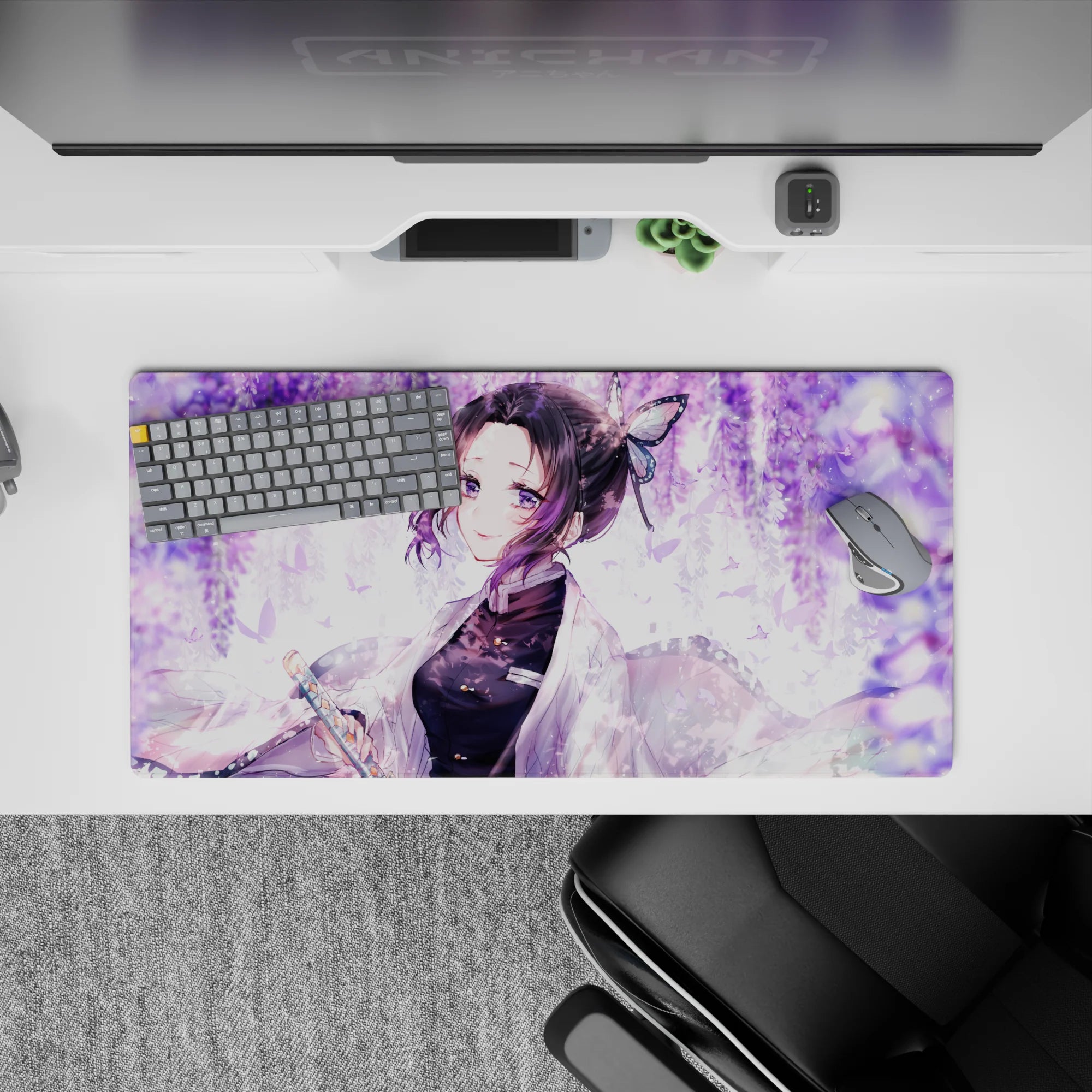 Anime mouse pad featuring Shinobu from Demon Slayer under wisteria, 32x16 inches. Soft lilac swirls and pastel butterflies.