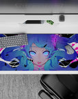 36x16 inches desk pad in neon violet and magenta, spooky-cute anime vibe with glowing eyes.