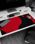 Itachi Uchiha Naruto desk pad, cloak flowing on bold red backdrop with hidden faces, 40x20 inches.