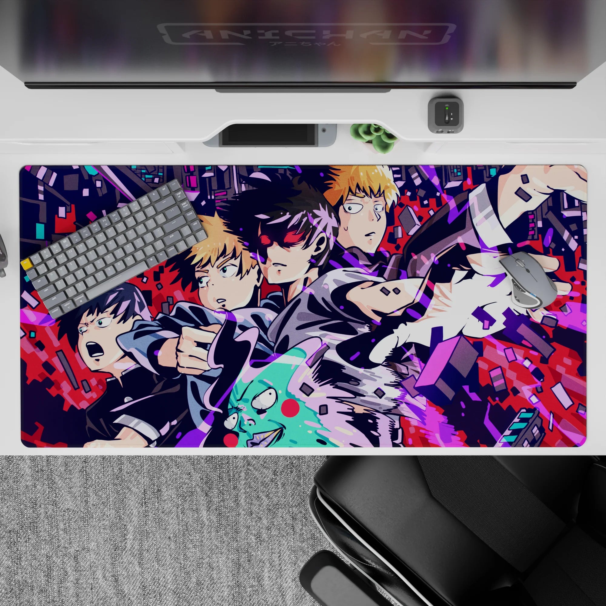 Electric magenta and blue chaos on black, loud cyber vibe anime desk pad, 40x20 inches.