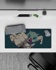 Anime mouse pad 28x12 inches featuring Inosuke from Demon Slayer in action, boar mask on, with a deep teal backdrop.