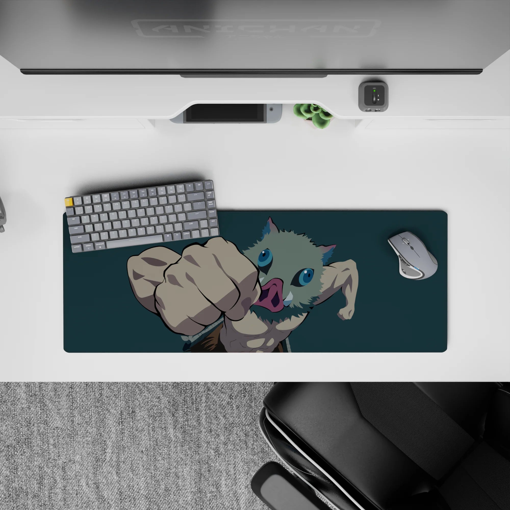 Inosuke from Demon Slayer mid-punch on a 32x12 inch mouse pad, dynamic pose with teal backdrop highlighting his intensity.
