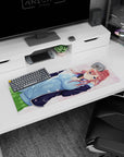 32x12 inches mouse pad showing blue-eyed redhead with headphones, blue hoodie and green skirt in petals.