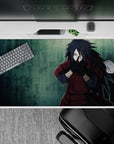Moody teal anime desk pad 40x20 inches with deep crimson accents and intense, brooding vibe.