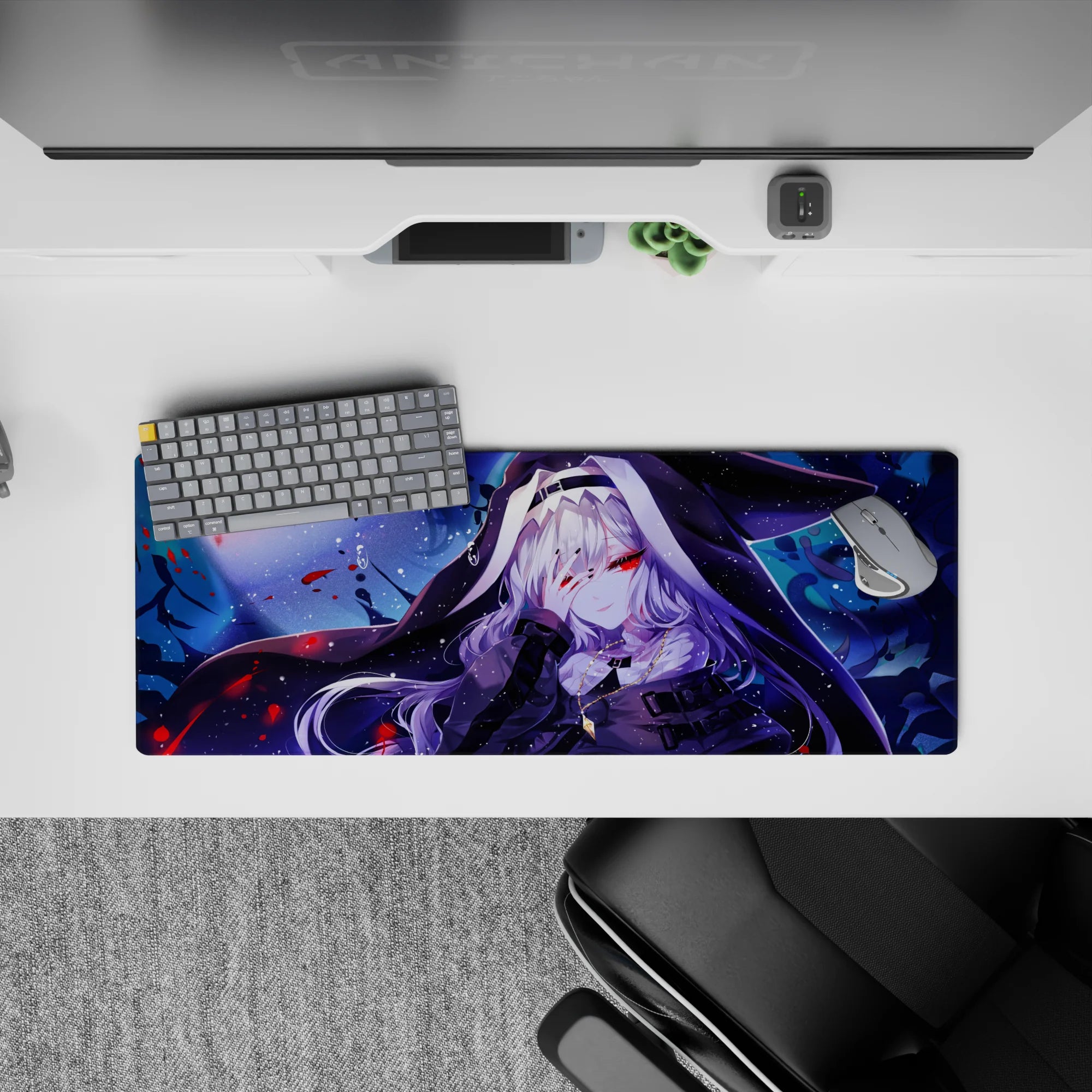 32x12 inches anime girl mouse pad in deep indigo and icy blue, speckled like snow with crimson accents.