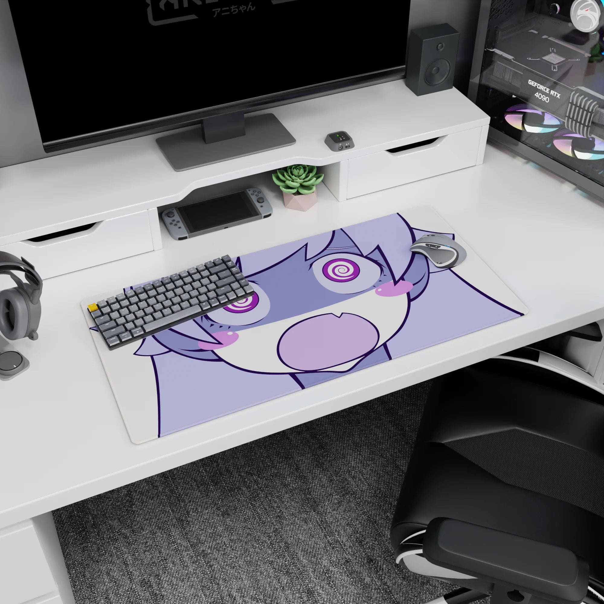 Chibi anime girl with puffy cheeks and wide spiral eyes staring at you on mouse pad, 32x16 inches.