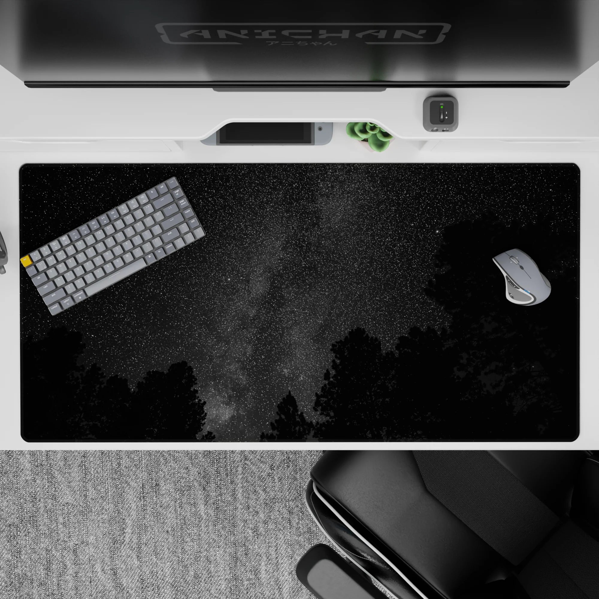 Moody charcoal black and smoky gray cosmic desk pad with tiny stars, 40x20 inches.