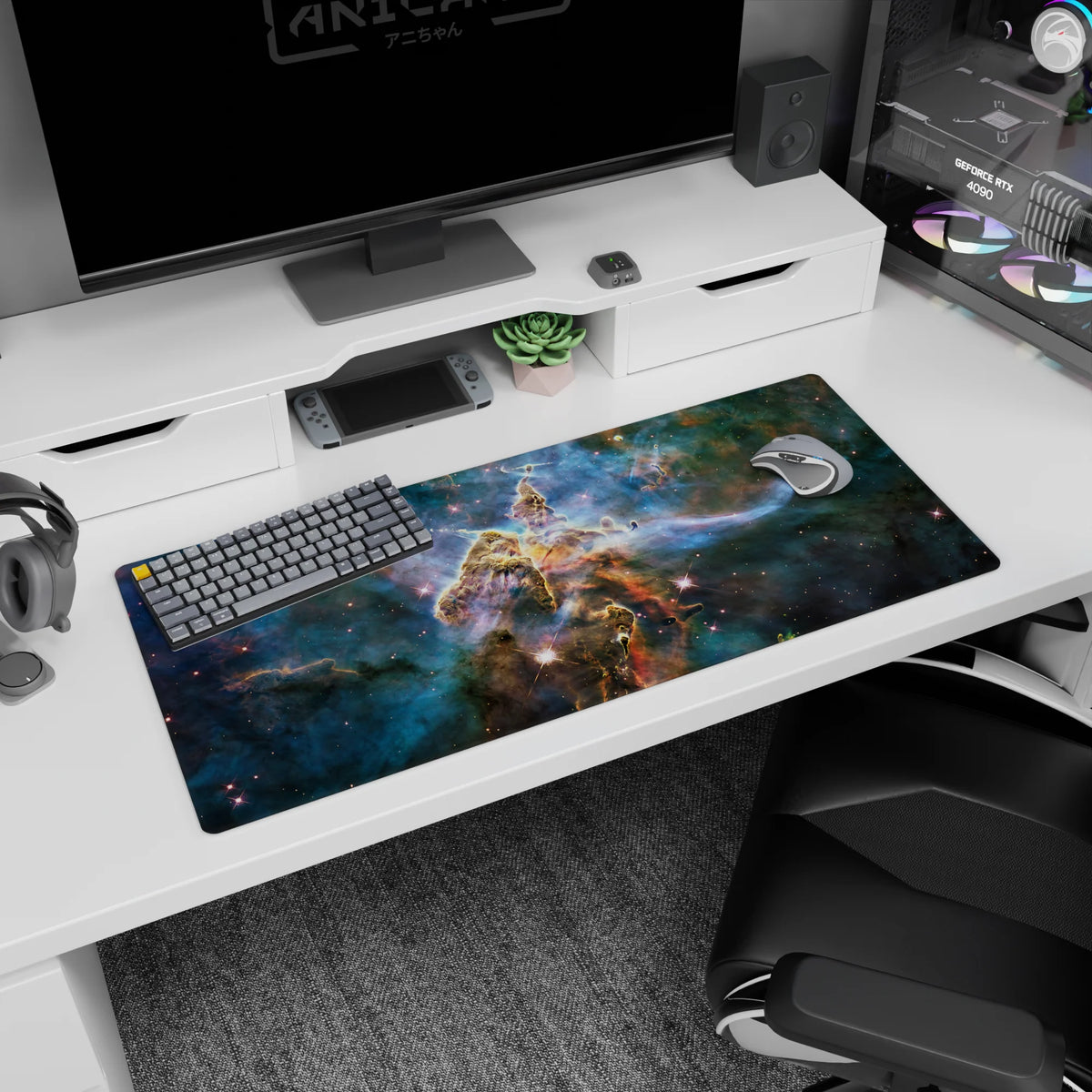 Starry nebula scene desk pad 36x16 inches, tiny sparkles over warm amber cloud swirls.