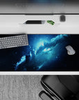 Midnight navy, inky black and icy blue glow desk pad, calm cosmic mood, 36x16 inches.
