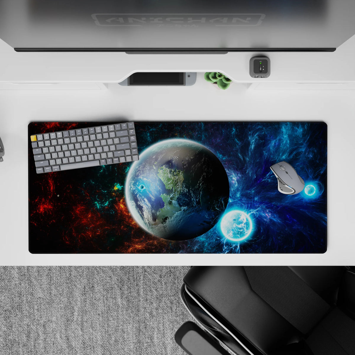 Cosmic desk pad in nebula blues, inky blacks, and fiery red accents, 36x16 inches.