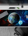 Moody 40x20 inches desk pad in nebula blues and inky blacks with subtle fiery red clouds at the edges.