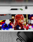 Cozy anime desk pad 36x16 inches in gold, blue, and candy-red bokeh with soft snowflakes.