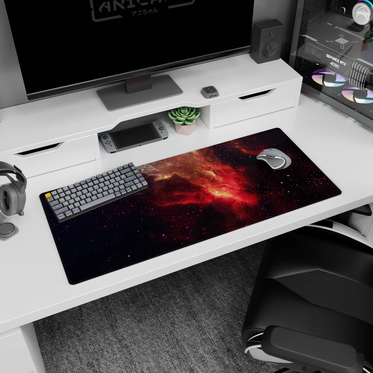 Deep-space scene desk pad showing swirling nebula clouds and confetti-like stars across dark space, 36x16 inches.