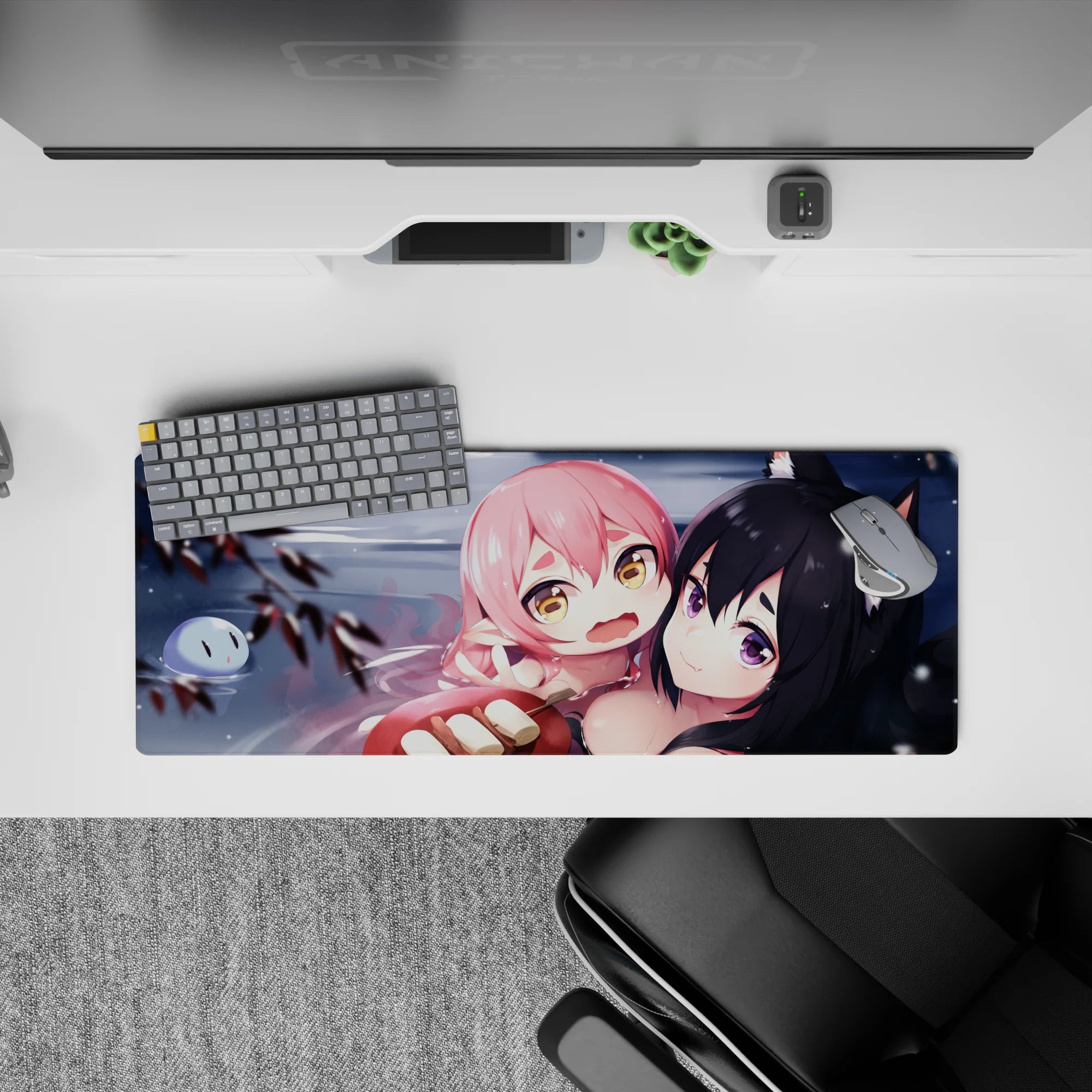 Cozy chaos anime girl mouse pad 32x12 inches in gray water tones with blush pops and snowy specks.