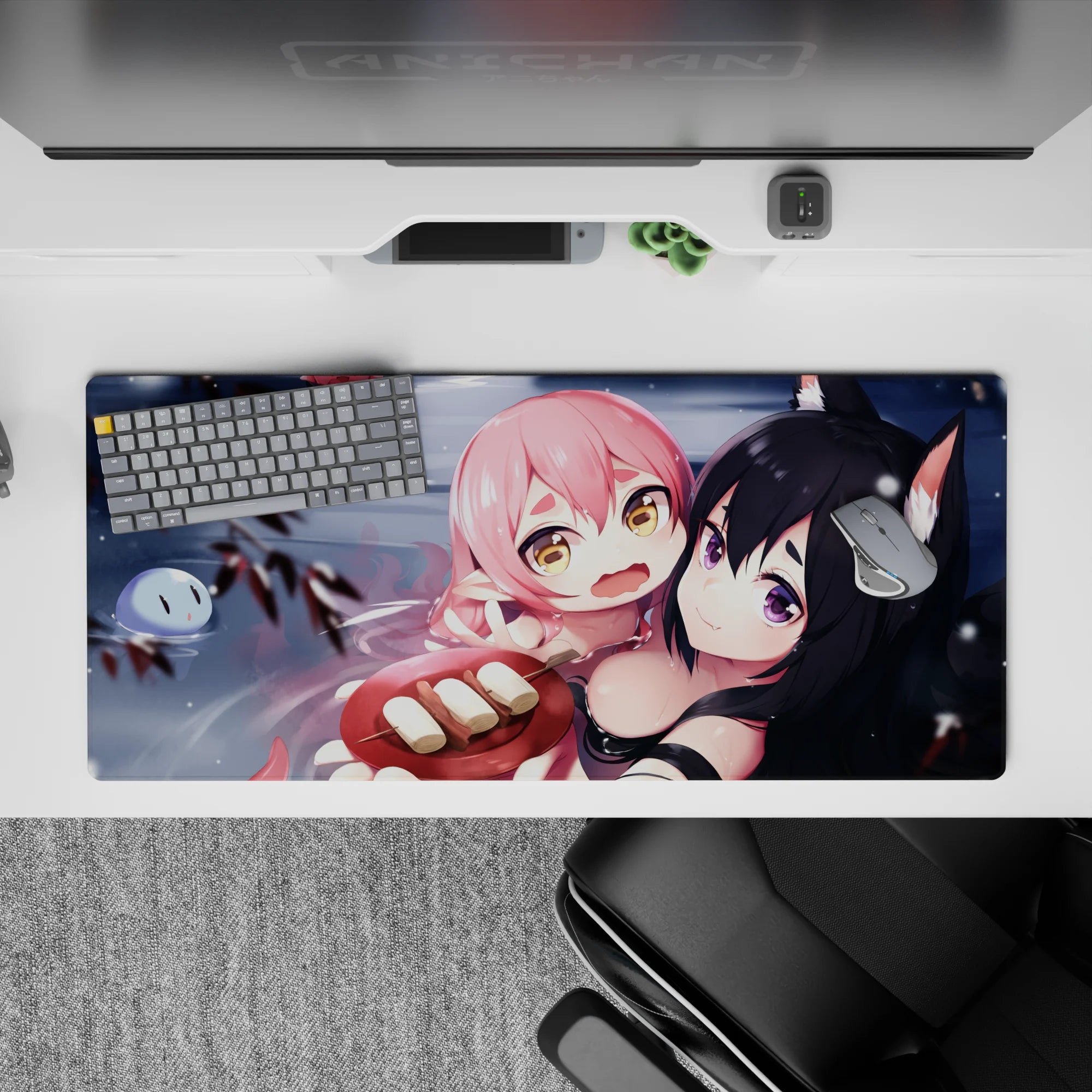 Cozy chaos anime desk pad 36x16 inches in cool grays with warm blush accents and cute floating faces.