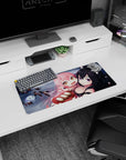 Pink-haired anime girl clings to fox-eared black-haired girl on 28x12 inches mouse pad with floating faces.